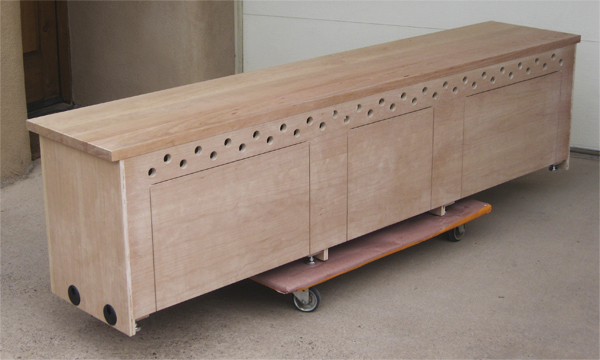 Allin TV Stand showing Back of Cabinet with future cutouts and ventilation holes unfinished